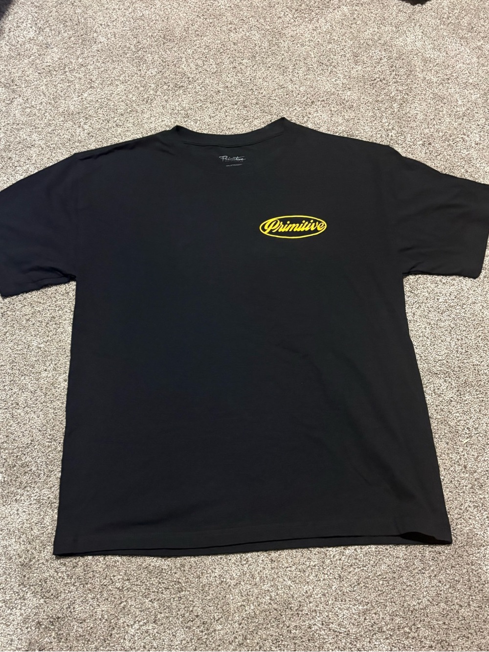 Primitive Black Tee with Yellow Chest Logo